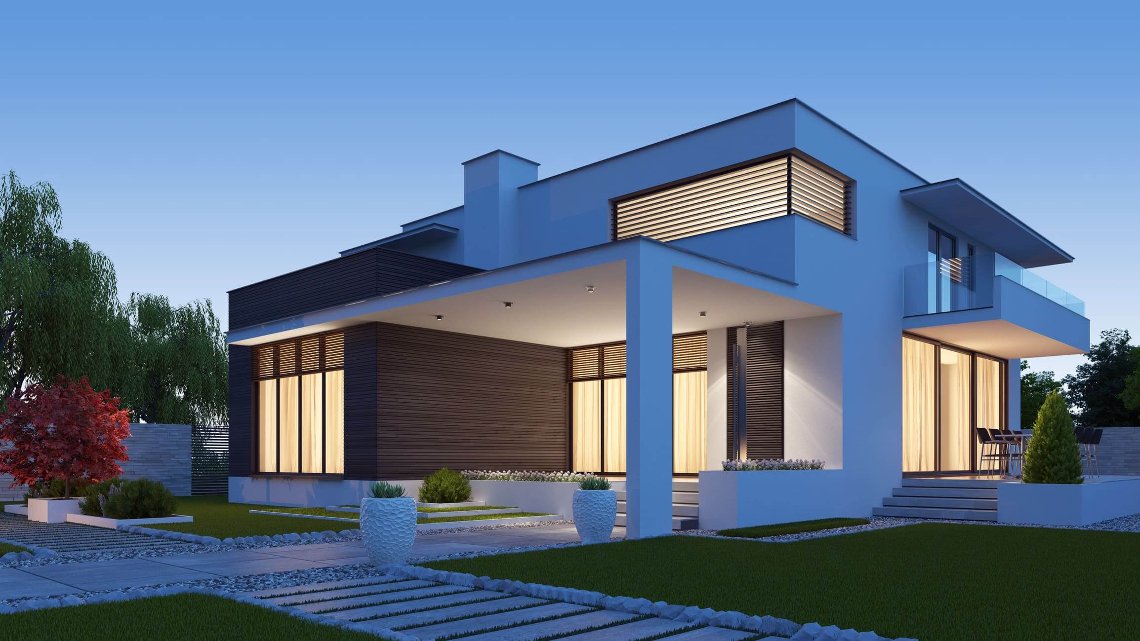 Modern house with large windows and outdoor lighting at dusk.